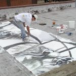 me painting on a rooftop in detroit - the marching grey sleepwalking figures