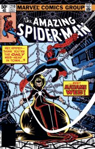 Description: An old woman with light skin and greying hair pulled back. She has a red slight V-shaped band pulled across her eyes. Her lips are pulled down in a slight frown. On the cover of a comic, she sits surrounded by spiderwebs as Spider-Man is poised to confront her. Caption text reads, “Hey, Spidey - think you’re the ONLY web-head in town…? …Meet MADAME WEB!”