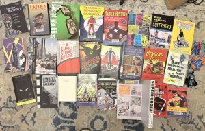 a photo of books of comics scholarship that I will be drawing on for the course